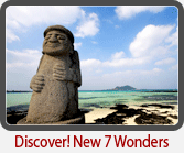 A Harubang stone figure beside the sea on Jeju Island